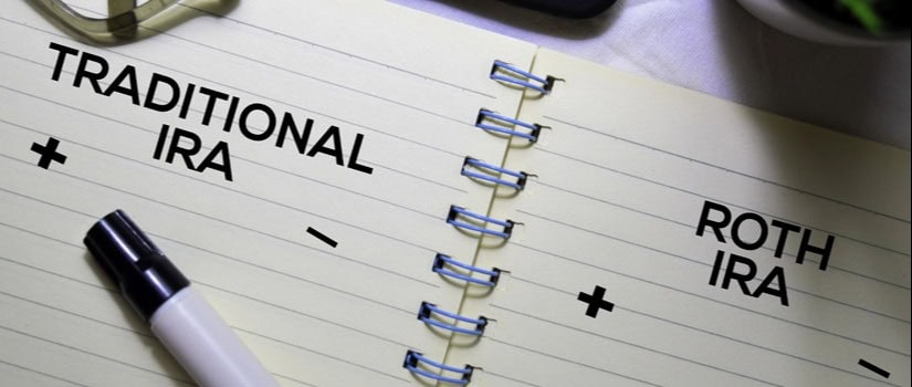 Notebook page comparing “Traditional IRA” and “Roth IRA,” with plus and minus symbols indicating differences, and a marker nearby.